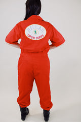 short sleeve red work jumpsuit with collar zips up front and patches on front and back vintage 1970's