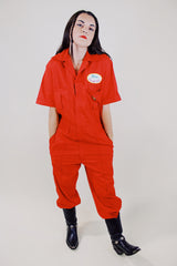 short sleeve red work jumpsuit with collar zips up front and patches on front and back vintage 1970's