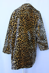 Women's vintage 1970's long sleeve long leopard print double breasted coat in velvet material.