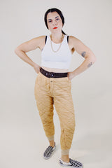 light tan quilted nylon military liner pants with brown trim popper closure vintage 1950's