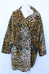 Women's vintage 1970's long sleeve long leopard print double breasted coat in velvet material.
