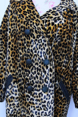 Women's vintage 1970's long sleeve long leopard print double breasted coat in velvet material.