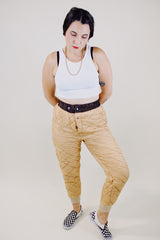 light tan quilted nylon military liner pants with brown trim popper closure vintage 1950's