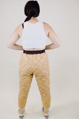 light tan quilted nylon military liner pants with brown trim popper closure vintage 1950's