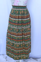 Women 's vintage 1970's cotton lightweight ankle length maxi skirt in all over green and brown abstract print.