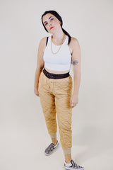 light tan quilted nylon military liner pants with brown trim popper closure vintage 1950's