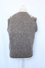 Women's or men's vintage 1970's Churchill Downs, Made in England label sleeveless sweater vest in grey wool with light pink and light blue argyle print on the front.