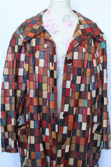 Women's or men's vintage 1970's long sleeve long length leather patchwork jacket with multicolored patchwork squares.
