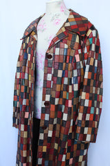 Women's or men's vintage 1970's long sleeve long length leather patchwork jacket with multicolored patchwork squares.