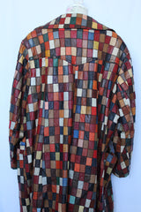 Women's or men's vintage 1970's long sleeve long length leather patchwork jacket with multicolored patchwork squares.