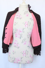 Women's vintage 1960's Charles F. Borg, Portland, Oregon label long sleeve black lace button up lace blouse with ruffle lace trim.