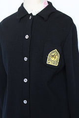 Women's vintage 1960's Dorce label long sleeve black wool button up cardigan with yellow patch with words La Costa on left chest.