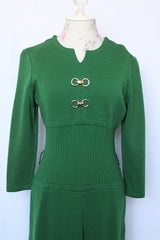 Women's vintage 1960's Dalton label long sleeve knee length green wool dress with a ribbed mid section and gold hardware detail on chest.
