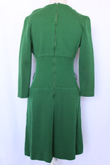 Women's vintage 1960's Dalton label long sleeve knee length green wool dress with a ribbed mid section and gold hardware detail on chest.