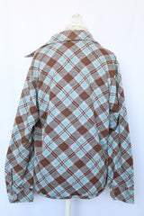 Women's vintage 1970's Golden Vee label long sleeve blue and brown plaid print button up shirt with dagger collar and brown buttons.