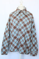 Women's vintage 1970's Golden Vee label long sleeve blue and brown plaid print button up shirt with dagger collar and brown buttons.