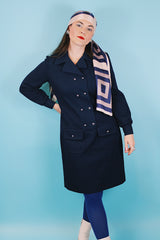 Women's vintage 1970's Butte Knit label long sleeve mini length shirt dress in navy blue thick textured polyester material with silver buttons.