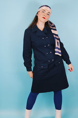 Women's vintage 1970's Butte Knit label long sleeve mini length shirt dress in navy blue thick textured polyester material with silver buttons.