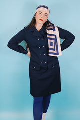 Women's vintage 1970's Butte Knit label long sleeve mini length shirt dress in navy blue thick textured polyester material with silver buttons.