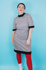 Women's vintage 1970's Mode O'Day, Styled in California label short sleeve mini length dress in black and white polyester material with diamond checkered print.