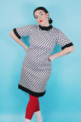 Women's vintage 1970's Mode O'Day, Styled in California label short sleeve mini length dress in black and white polyester material with diamond checkered print.