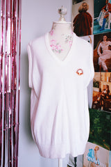 sleeveless white sweater vest with v neck with crest on left chest vintage 1970's