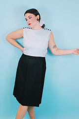 Women's vintage 1960's Richard Frontman label sleeveless twofer knee length sheath dress in cotton blend material. Top half is baby blue and bottom half is black.