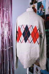 long sleeve grey pullover wool sweater with navy and red argyle print