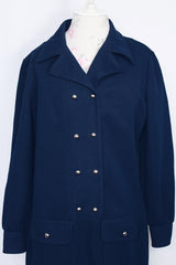 Women's vintage 1970's Butte Knit label long sleeve mini length shirt dress in navy blue thick textured polyester material with silver buttons.