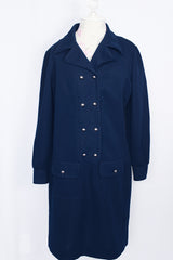Women's vintage 1970's Butte Knit label long sleeve mini length shirt dress in navy blue thick textured polyester material with silver buttons.