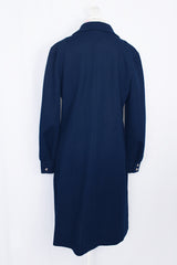 Women's vintage 1970's Butte Knit label long sleeve mini length shirt dress in navy blue thick textured polyester material with silver buttons.