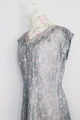 Women's vintage 1950's capped sleeved midi length lace fancy dress. Fully lined in lilac polyester with baby blue lace overlay.