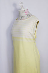 Women's vintage 1970's Jantzen, Made in USA label sleeveless midi length soft acrylic dress in baby yellow with white and yellow stripes across chest.