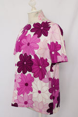 Women's vintage 1960's short sleeve floral print cotton blouse with one button closure in the back. White with purple flowers.