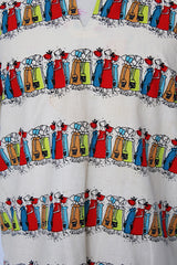 Women's vintage 1970's Kerrybrooke (sub brand of Sears) label 3/4 length sleeves cream colored cotton tunic blouse with all over multi colored maid print.
