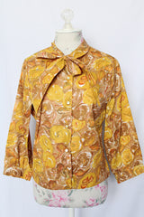 Women's vintage 1960's Diane Young label 3/4 arm length button up blouse in yellow and brown all over floral print