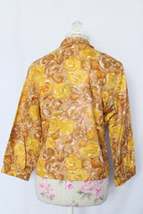Women's vintage 1960's Diane Young label 3/4 arm length button up blouse in yellow and brown all over floral print