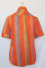 Women's vintage 1970's Aaron Ashley label short sleeve button up blouse with collar, two chest pockets, and side slits.