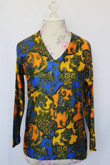 Women's vintage 1970's long sleeve all over paisley print blouse with V shaped neckline in slinky polyester material.