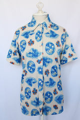 Women's vintage 1970's Montgomery Ward short sleeve button up printed blouse collared blouse. Cream with all over blue print.