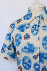 Women's vintage 1970's Montgomery Ward short sleeve button up printed blouse collared blouse. Cream with all over blue print.