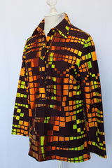 Women's vintage 1970's Styled by Terry, Chicago label long sleeve blouse with half button closure in the front and a rounded collar.