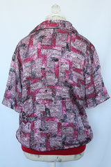 Women's or men's vintage 1980's Alan Stuart short sleeve pullover half button closure shirt with collar and knitted ribbed hem.