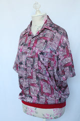 Women's or men's vintage 1980's Alan Stuart short sleeve pullover half button closure shirt with collar and knitted ribbed hem.