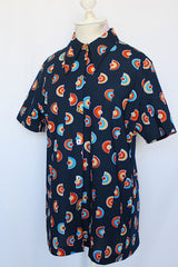 Women's vintage 1970's short sleeve navy button up shirt blouse with dagger collar and all over print in orange, brown, and blue