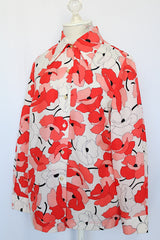 Women's vintage 1970's Sears Fashions label long sleeve button up blouse with pointy collar and darted bust. Polyester material in white with all over red and pink poppy floral print.