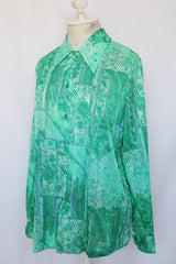 Women's vintage 1970's Mr. Alex a division of Alex Colman label long sleeve button up blouse with pointy collar in nylon material.