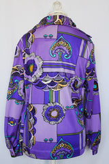 Women's vintage 1970's Pykettes label long sleeve button up blouse with pointy collar in thick polyester material.