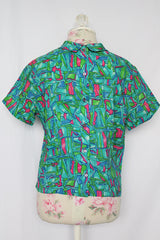 Women's vintage 1960's Majorette short sleeve blouse with buttons in the back, attached tie bow on neck.