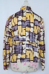 Women's vintage 1960's Fritzi of California label long sleeve mock neck blouse with zipper in the back.